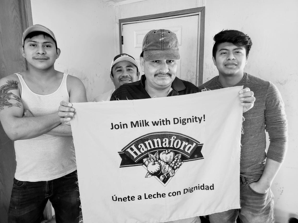 Bernardino Suchite Canan (far left) with co-workers, calling on Hannaford Supermarket to join Migrant Justice's Milk with Dignity Program. Undated photo.