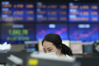 A currency trader watches monitors at the foreign exchange dealing room of the KEB Hana Bank headquarters in Seoul, South Korea, Thursday, Sept. 23, 2021. Asian shares were mostly higher on Thursday after the Federal Reserve signaled it may begin easing its extraordinary support measures for the economy later this year. (AP Photo/Ahn Young-joon)