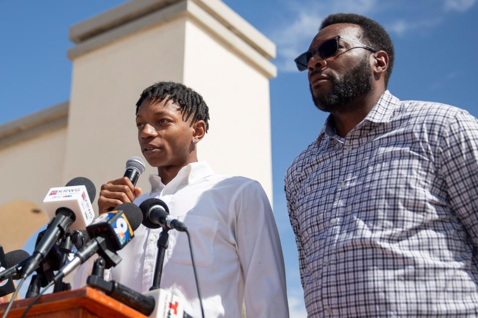 Deuce Benjamin, left, tears up while speaking about the assault he faced while playing for NMSU during a news conference held by the two former NMSU players and their lawyers on Wednesday, May 3, 2023, at New Mexico State University. The lawsuit alleges that the freshman players were sexually assaulted by older players and the school failed to intervene despite being aware of the assaults.