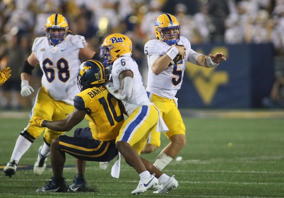 Pittsburgh Panthers Phil Jurkovec (5) evades a tackle while racing downfield during the second half against the West Virginia Mountaineers at Milan Puskar Stadium in Morgantown, WV on September 16, 2023.