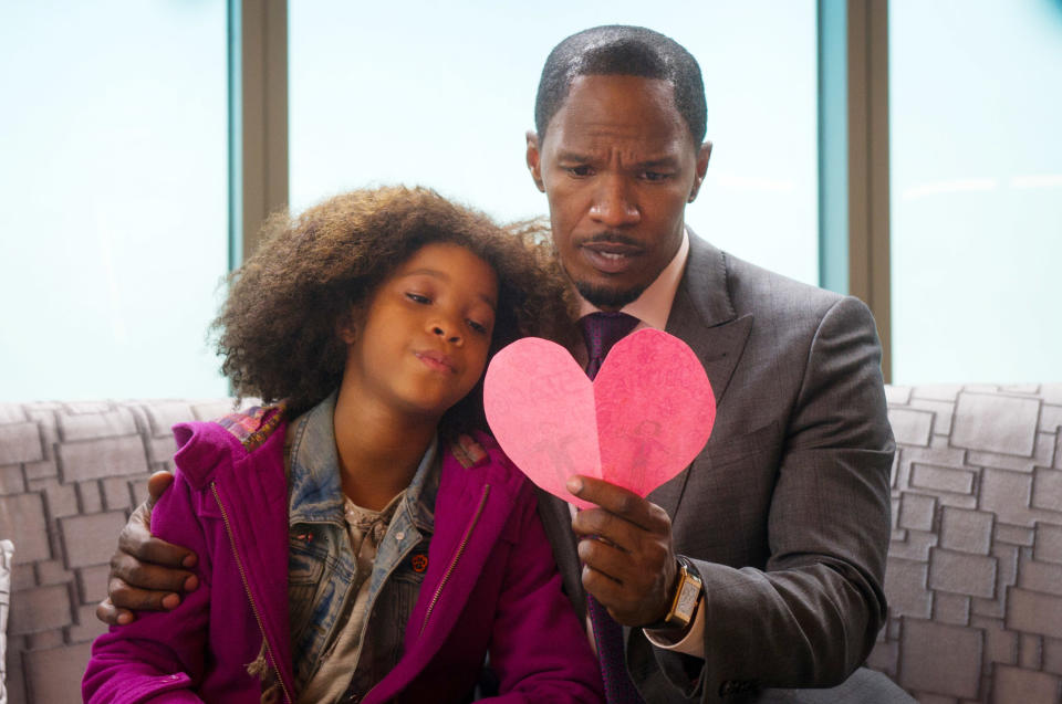 Quvenzhané with Jamie Foxx, who's holding a paper heart