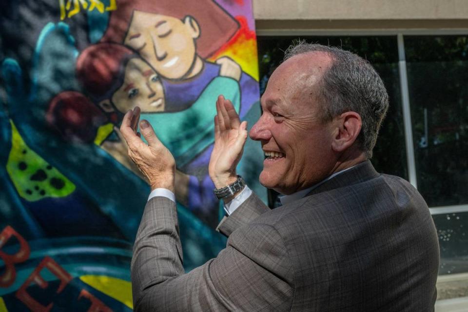 Supervisor Rich Desmond applauds speakers at the grand opening of the Community Outreach Recovery Empowerment, or CORE, program site at 1400 X Street in Sacramento for homeless on Thursday. “I’m happy to witness the transformative impact that this site is going to have in this community,” said Desmond who also spoke at the event.