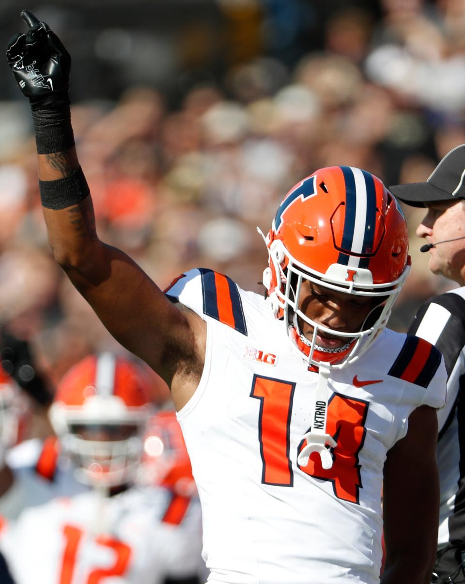 Illinois Fighting Illini defensive back Xavier Scott (14) reacts to a defensive stop during the NCAA football game against the Purdue Boilermakers, Saturday, Sept. 30, 2023, at Ross-Ade Stadium in West Lafayette, Ind.