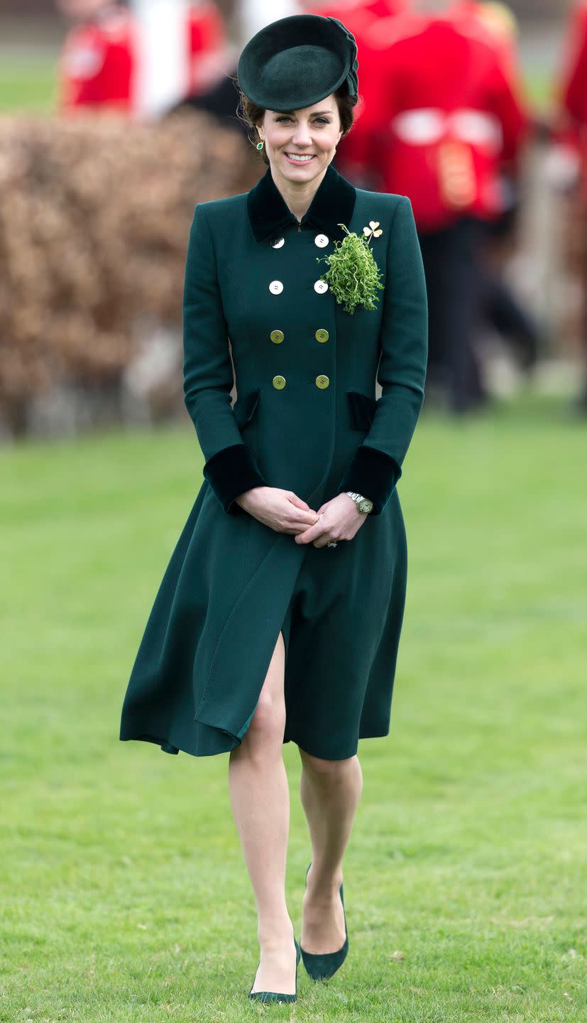 <p>In a forest green Catherine Walker coat dress, matching hat, Irish Guard brooch, Monica Vinader emerald earrings and suede Gianvito Rossi pumps at the St. Patrick's Day parade in London.</p>