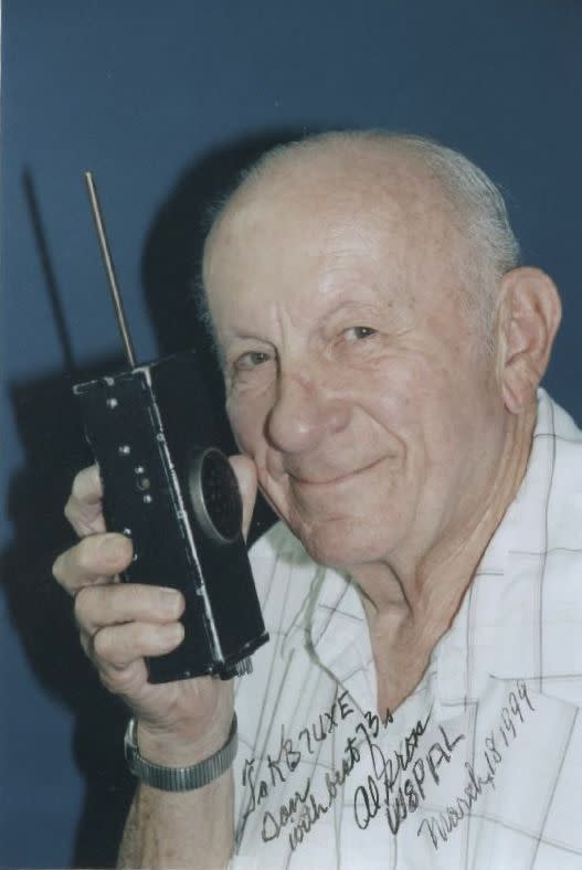 Signed photograph from 1999 of Al Gross, the engineer, holding his invention, the radio