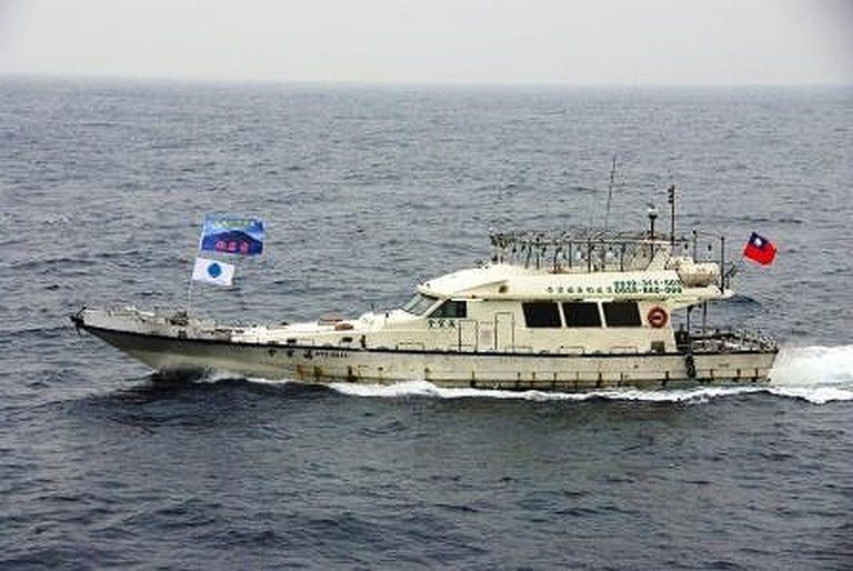 This photo, released by Japan Coast Guard on January 24, 2013, shows a boat carrying Taiwanese activists, cruising in waters near the disputed islands known as Senkaku islands in Japan and Diaoyu islands in China, in the East China Sea. The boat gave up a plan to land on the East China Sea islands after being blocked by Japanese coastguard vessels