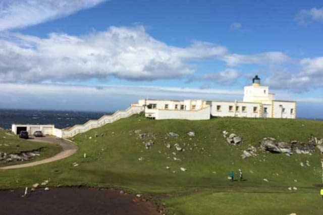 The outside of the lighthouse from the land