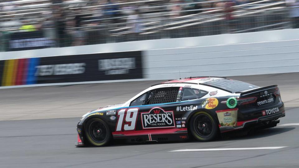 Martin Truex Jr., steers his car into Turn 1 during Monday’s Crayon 301 at New Hampshire Motor Speedway. (AP Photo/Steven Senne)