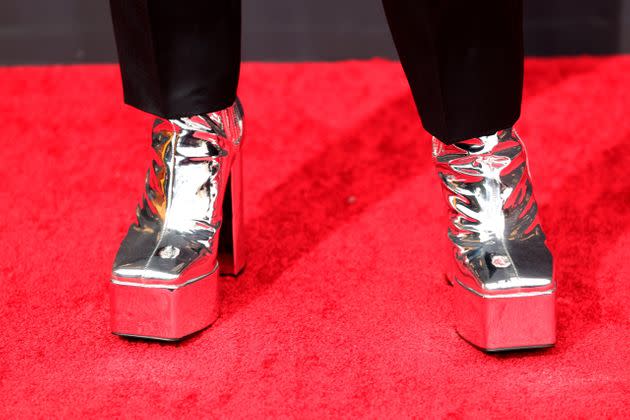 Bowen Yang wore silver platform heels by Syro.   (Photo: Rich Fury via Getty Images)