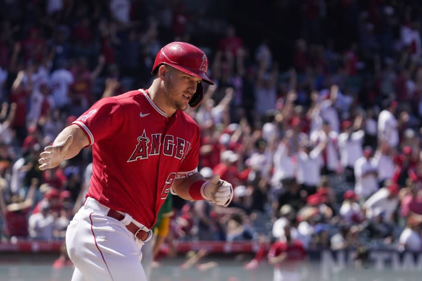 Los Angeles Angels' Mike Trout rounds first after hitting a solo home run