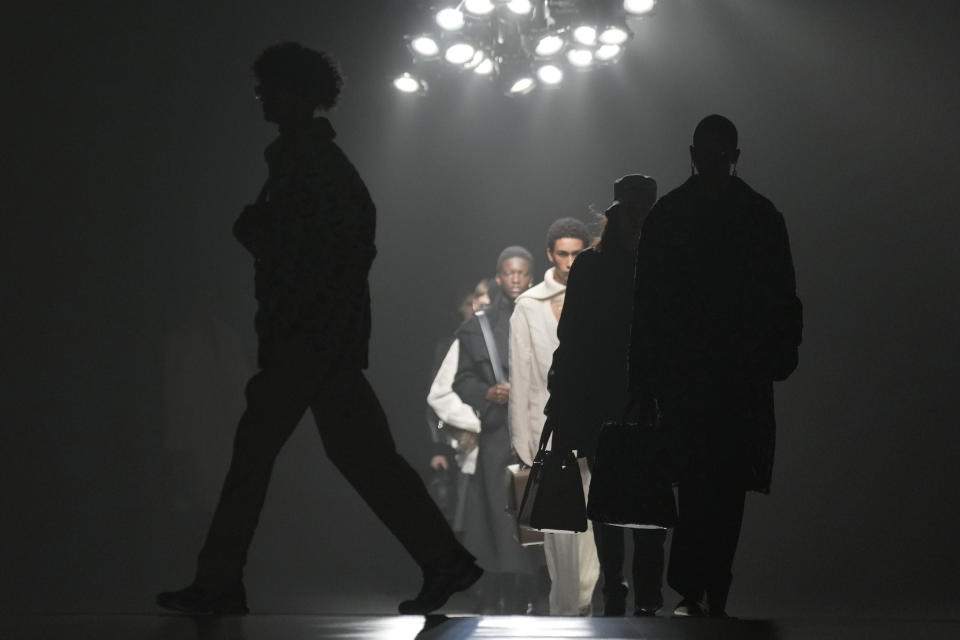 Models wear creations for the Fendi fall winter 22/23 collection, in Milan, Italy, Saturday, Jan. 15, 2022. (AP Photo/Antonio Calanni)