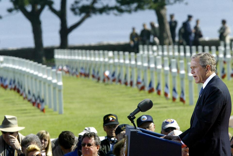 President George W. Bush delivers a speech during ceremonies on June 6, 2004, at the American cemetery in Colleville-sur-Mer, France, during the 60th anniversary of the D-Day invasion on Omaha Beach.