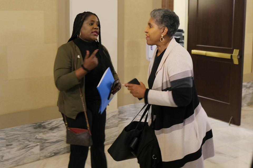 Tiffany Crutcher, left, speaks Thursday with Rep. Regina Goodwin before the House General Government Committee meeting at the Oklahoma Capitol.