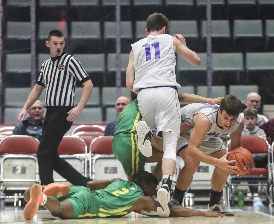 Bryce Hollo of Chapel Field comes up with the loose ball after a scramble with North Warren during a NYSPHSAA Class D semifinal basketball game at the Cool Insuring Arena in Glens Falls March 18, 2023.