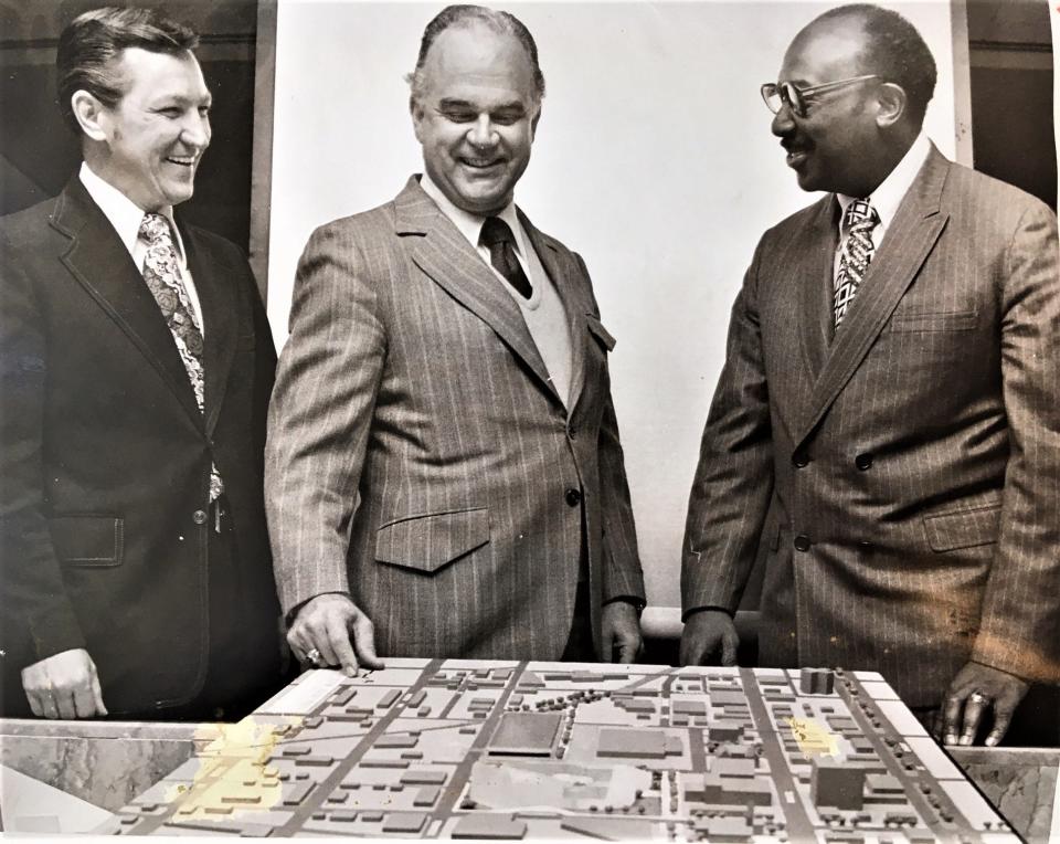 FILE - Don Neal (from left), Gene Holley and Ed McIntyre look over plans for new civic center in the 1970s.