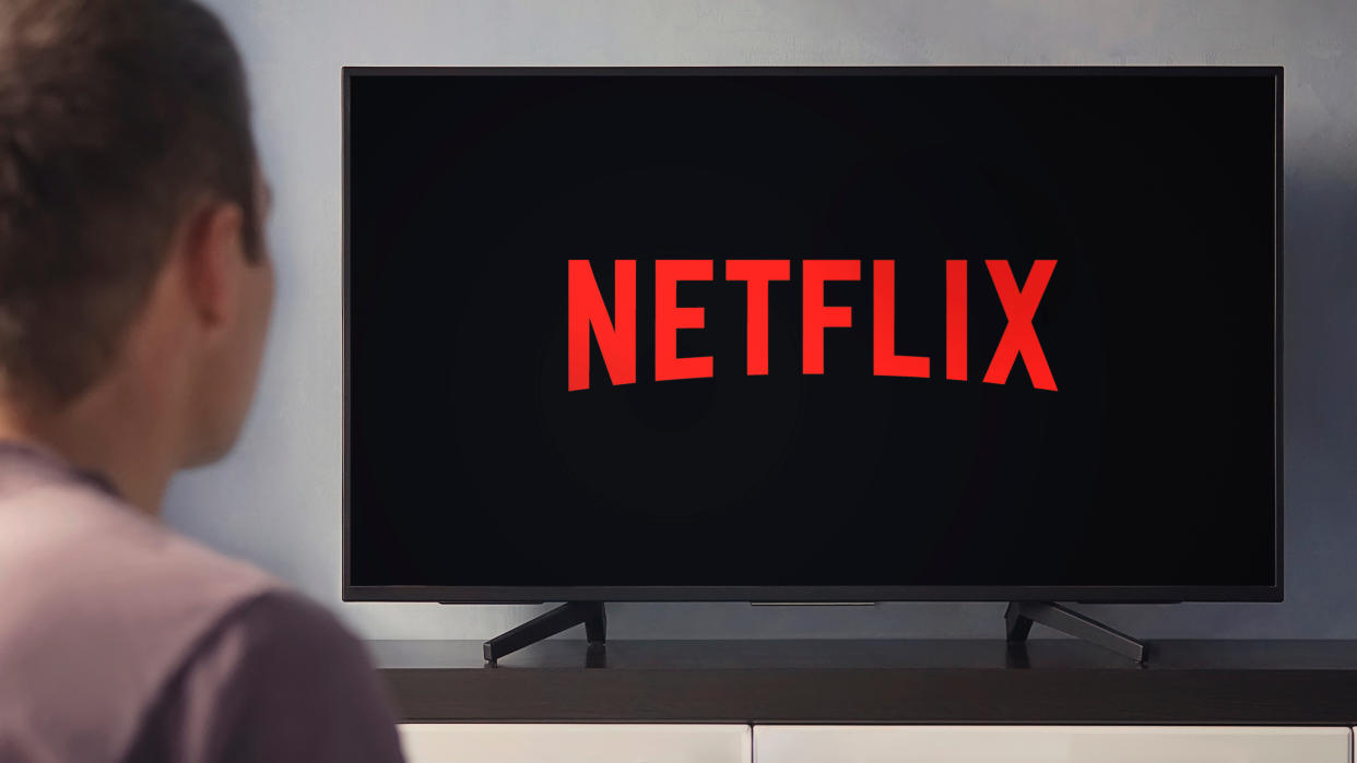  Man watching Netflix on TV 