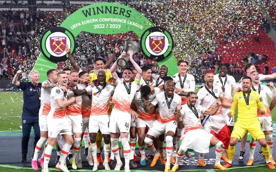 West Ham celebrate winning the Europa Conference League final with the trophy on the podium
