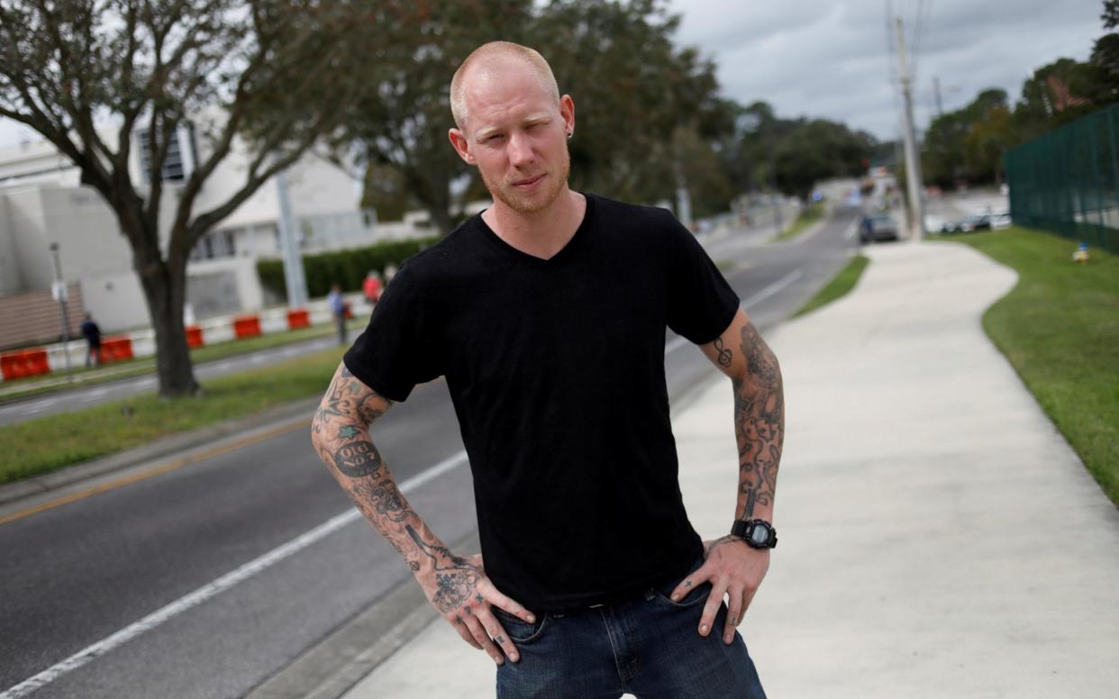 Tyler Tenbrink, a self proclaimed White Nationalist who drove from Texas, poses for a portrait before the speech by Richard Spencer in Gainesville - REUTERS