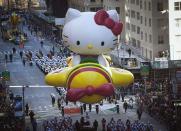 The Hello Kitty balloon float makes its way down 6th Avenue during the 87th Macy's Thanksgiving day parade in New York November 28, 2013. REUTERS/Carlo Allegri (UNITED STATES - Tags: ENTERTAINMENT SOCIETY)