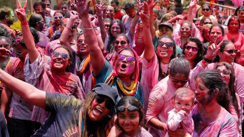 People covered in colored powder participate in the Holi Festival celebrated as the Festival of Colors, Love and Spring in Nairobi, Kenya on March 24, 2024.