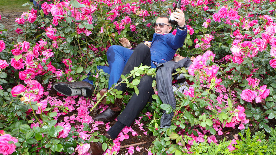 Drunk punters, pictured here wrestling in the bushes after the 2018 Melbourne Cup.