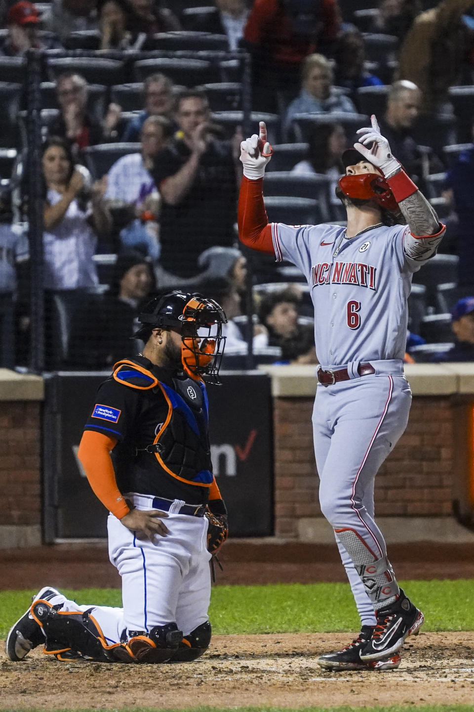 Cincinnati Reds' Jonathan India, right, celebrates after hitting a two-run home run during the seventh inning of a baseball game against the New York Mets, Friday, Sept. 15, 2023, in New York. (AP Photo/Bebeto Matthews)