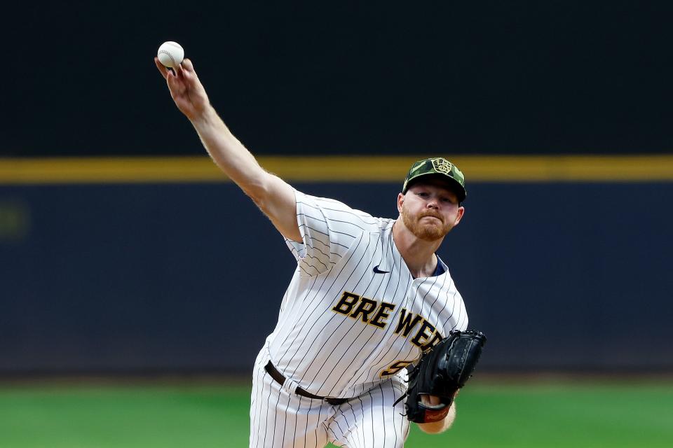 Brandon Woodruff throws a pitch in the first inning at American Family Field on Saturday.