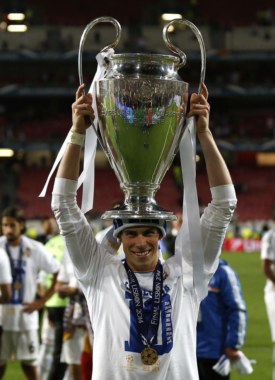 FILE - Real's Gareth Bale, lifts the Champion League trophy on his head, after the Champions League final soccer match between Atletico Madrid and Real Madrid in Lisbon, Portugal, Saturday, May 24, 2014. (AP Photo/Andres Kudacki, File)