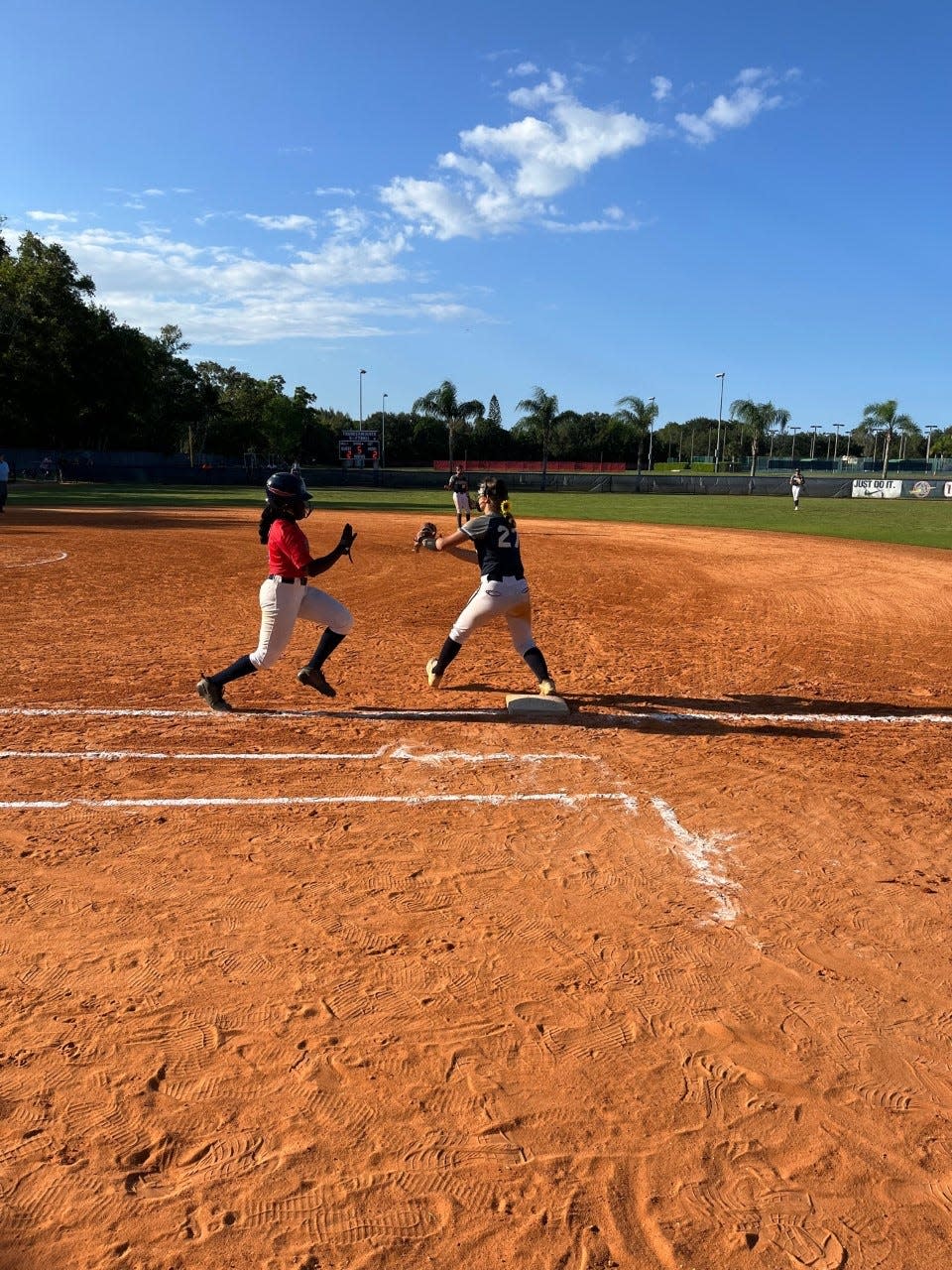 Oxbridge Academy's Gabby Edwards races to first base during the ThunderWolves' state playoff game against AIE (Miami Shores) on May 16, 2023 in West Palm Beach.