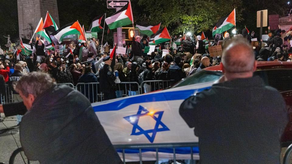 PHOTO: Counter-protesters hold an Israeli flag across the street from the main pro-Palestinian protest before a march through Midtown Manhattan during a protest calling for a ceasefire between Israel and Hamas, Nov. 11, 2023. (Pacific Press/Getty Images)