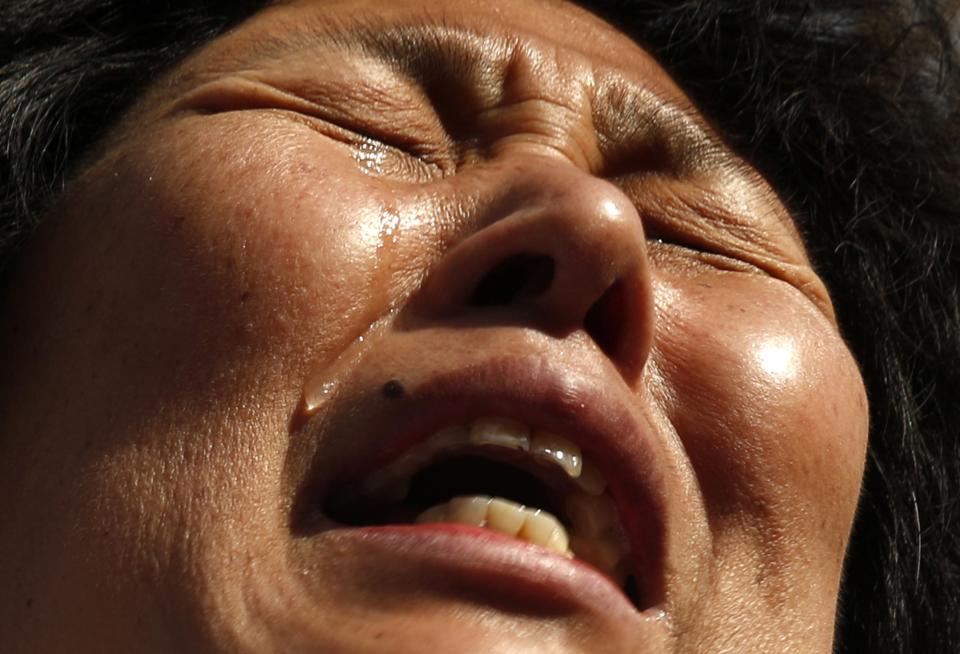 Liu cries during a gathering outside the Malaysian embassy in Beijing