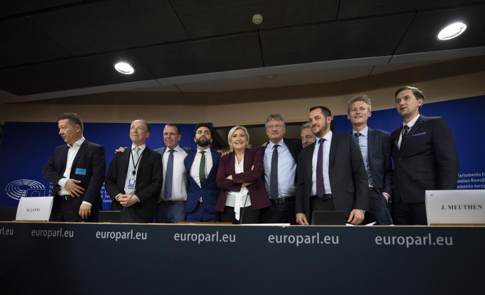 French far-right National Rally leader and MEP Marine Le Pen, center, poses with other far-right members during a media conference to announce the formation of a new far-right European Parliament group at the European Parliament in Brussels, Thursday, June 13, 2019. From left, Czech Republic's Tomio Okamura, Finland's Jussi Halla-Aho, Austria's Harald Vilimsky, Italy's Marco Zanni, Germany's Joerg Meuthen, Belgium's Gerolf Annemans, France's Nicolas Bay, Denmark's Peter Kofod and Estonia's Jaak Madison. (AP Photo/Virginia Mayo)