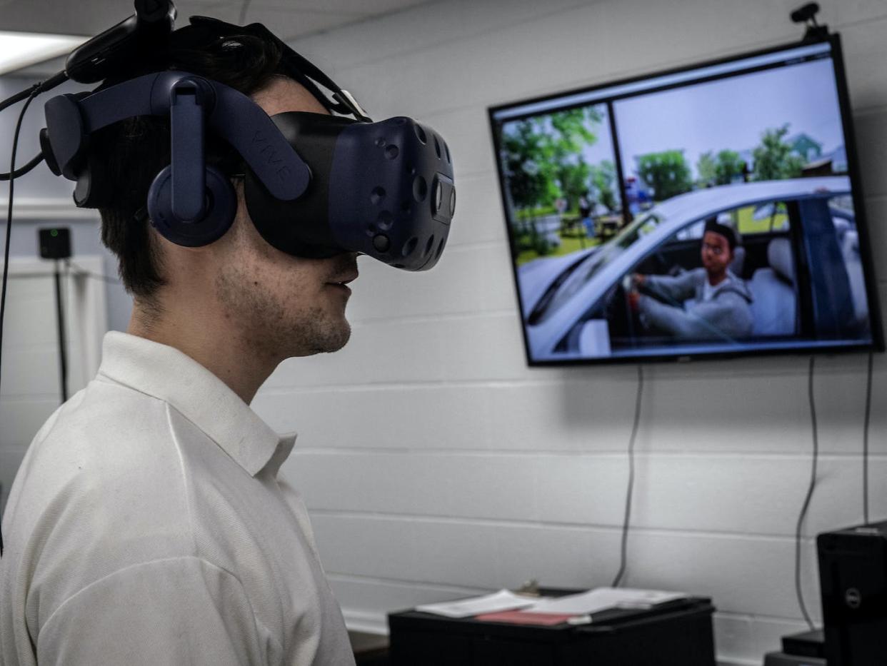 A student wears virtual reality goggles and headphones as part of a digital learning experience. <a href="https://www.gettyimages.com/detail/news-photo/connor-powelson-graduate-assistant-and-phd-candidate-news-photo/1240927332" rel="nofollow noopener" target="_blank" data-ylk="slk:Bill O'Leary/The Washington Post via Getty Images;elm:context_link;itc:0;sec:content-canvas" class="link ">Bill O'Leary/The Washington Post via Getty Images</a>
