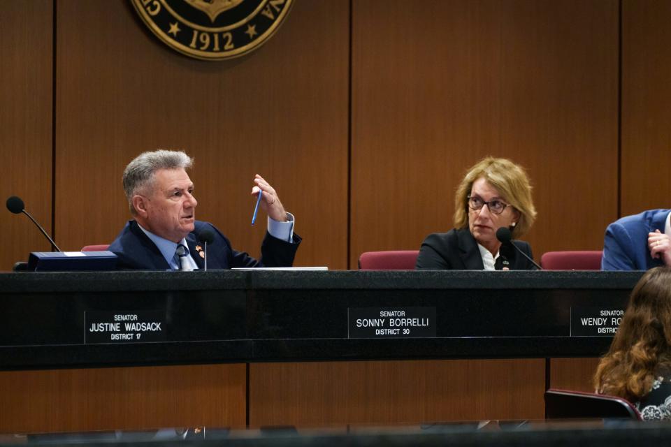 Sens. Sonny Borrelli, left, and Wendy Rogers attend a joint House and Senate election committee hearing at the state Capitol in Phoenix on Feb. 23, 2023.