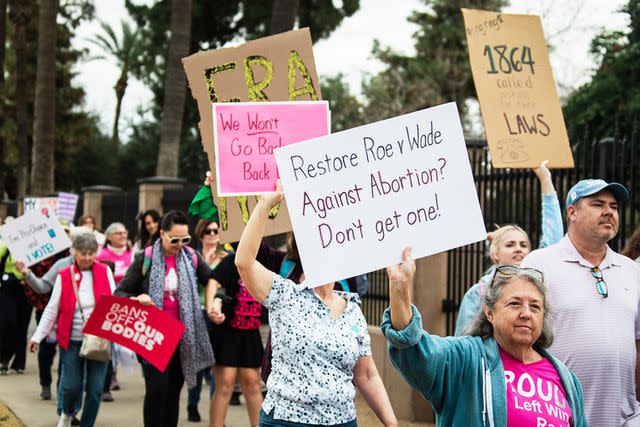 <p>Caitlin O'Hara/Bloomberg/Getty</p> Demonstrators during an Arizona Women's March rally in January 2024