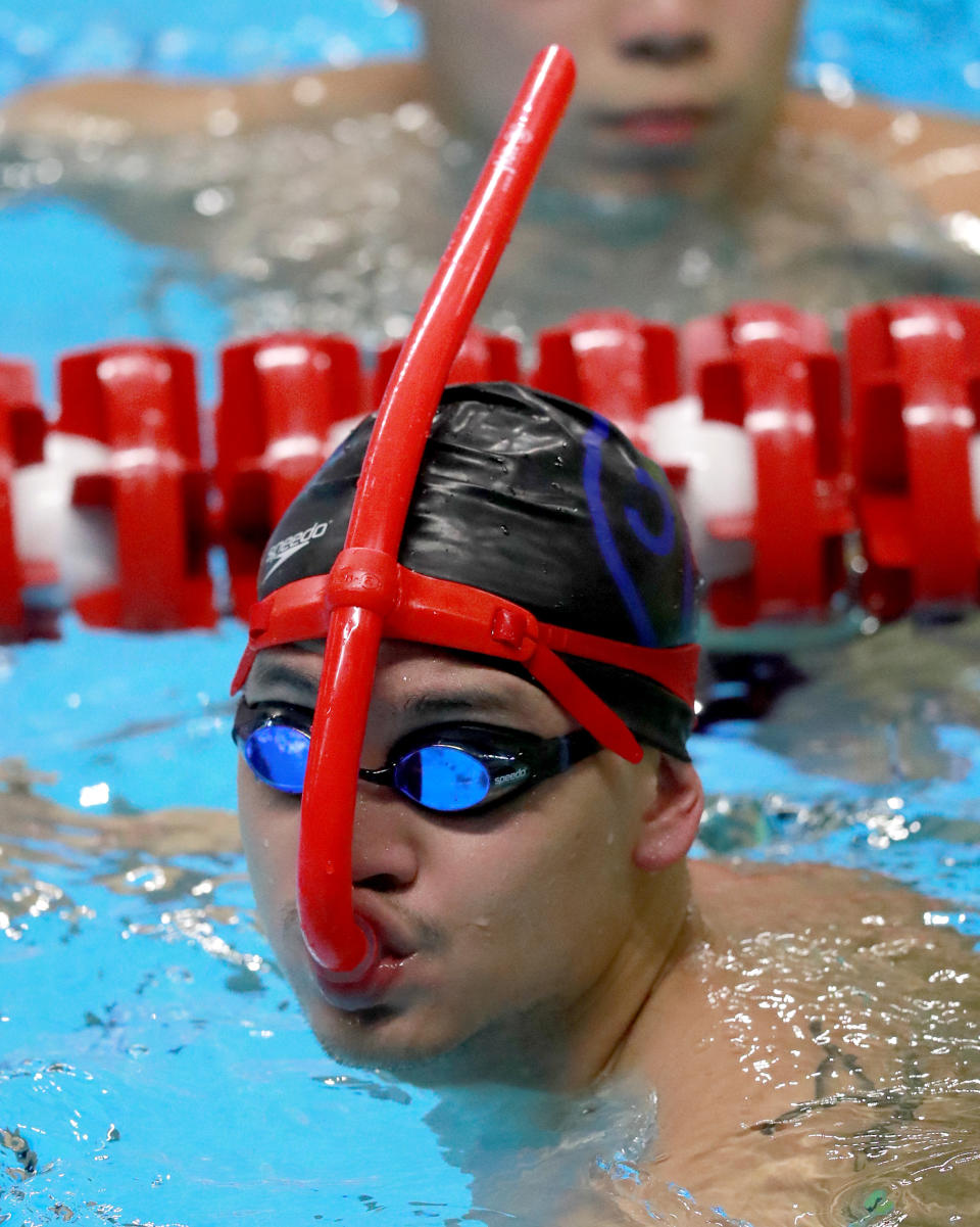 Singapore's Joseph Schooling swims during a training session at the 18th Asian Games in Jakarta, Indonesia, Friday, Aug. 17, 2018. (AP Photo/Bernat Armangue )