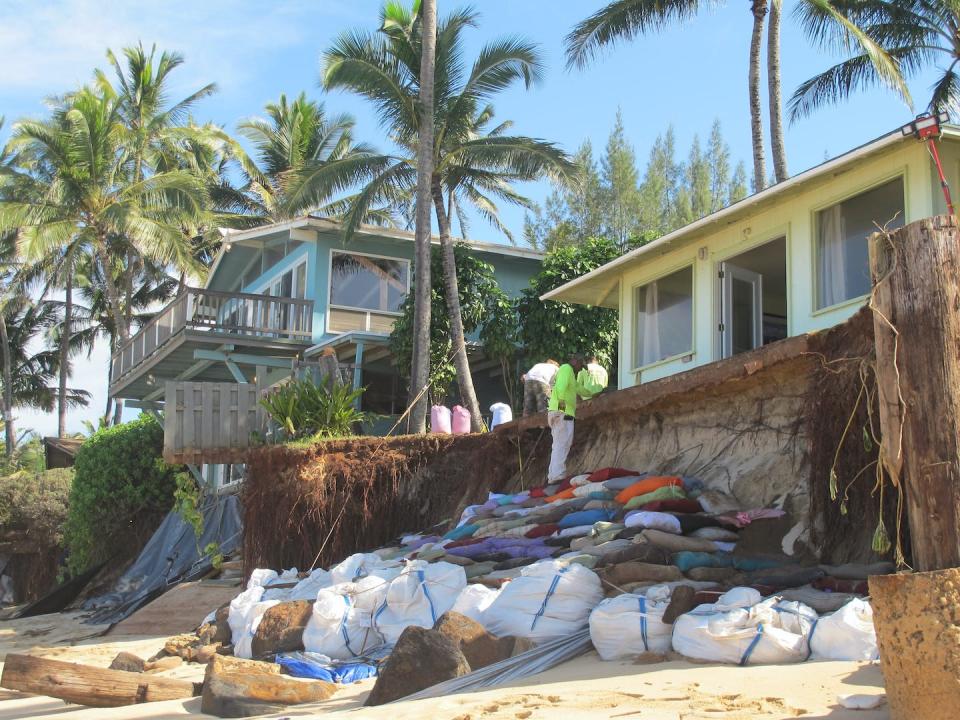 Several coastal communities, including in Honolulu County, facing increasing erosion want oil companies to help pay for protective infrastructure. <a href="https://newsroom.ap.org/detail/4c2fc5b90f894fe7963daeb19724bce4?ext=true" rel="nofollow noopener" target="_blank" data-ylk="slk:AP Photo/Audrey McAvoy;elm:context_link;itc:0;sec:content-canvas" class="link ">AP Photo/Audrey McAvoy</a>