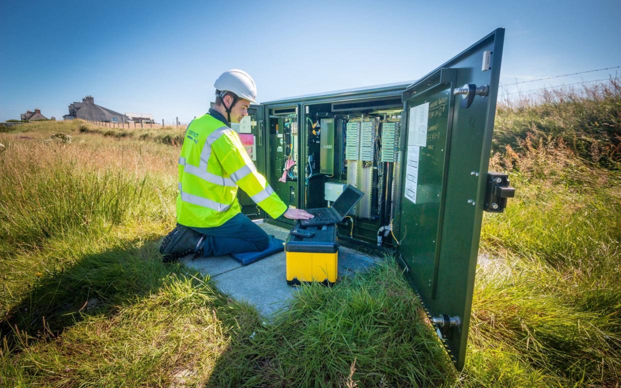 Photo issued by BT of Openreach engineer Stuart MacDonald in North Tolsta, as the remote community in the Western Isles is the first in Scotland to test increased broadband speeds over long phone lines - PA