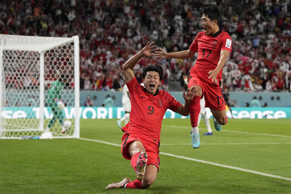 South Korea's Cho Gue-sung, center, celebrates with South Korea's Na Sang-ho, right, after scoring his side's second goal during the World Cup group H soccer match between South Korea and Ghana, at the Education City Stadium in Al Rayyan, Qatar, Monday, Nov. 28, 2022. (AP Photo/Lee Jin-man)