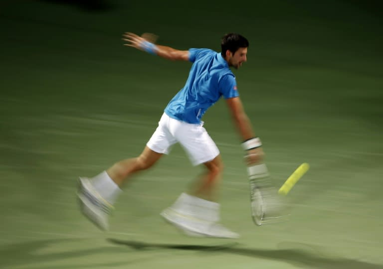 Serbian Novak Djokovic returns the ball to Spanish Tommy Robredo during their ATP tennis match on the first round of the Dubai Duty Free Tennis Championships on February 22, 2016