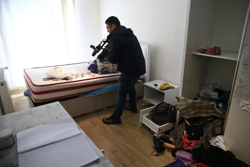 A news cameraman shoots footage of belongings inside the flat where a suspect of New Year's Day nightclub attack was arrested during an overnight police raid, in Istanbul, Tuesday, Jan. 17, 2017. Turkish police said they captured the gunman who carried out the deadly New Year's nightclub attack in Istanbul, with officials saying Tuesday that he's an Uzbekistan national who trained in Afghanistan and confessed to the massacre. (AP Photo/Lefteris Pitarakis)