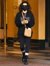 <p>Eva Longoria bundles up in a black sweatshirt, pants and boots while out on Monday in L.A.</p>