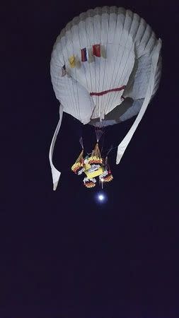 The Two Eagles balloon, with pilots Leonid Tiukhtyaev and Troy Bradley, launches in Saga, Saga Prefecture in this January 25, 2015 picture courtesy of Tsuyoshi Ogushi of the Two Eagles Balloon Team. REUTERS/Tsuyoshi Ogushi/Two Eagles Balloon Team/Handout via Reuters