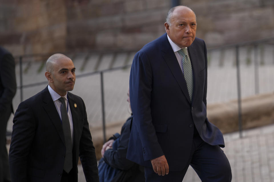 Egypt's Foreign Minister Sameh Shoukry, right, arrives at the Union for the Mediterranean event in Barcelona, Spain, Monday, Nov. 27, 2023. Delegations from the European Union member states and from Middle East and northern Africa countries are meeting Monday in Barcelona, Spain, to discuss the crisis in Gaza where a fragile pause in fighting is set to expire. Forty-two delegations will gather at the Union for the Mediterranean event with many represented by their foreign ministers. Israel is not attending. (AP Photo/Emilio Morenatti)