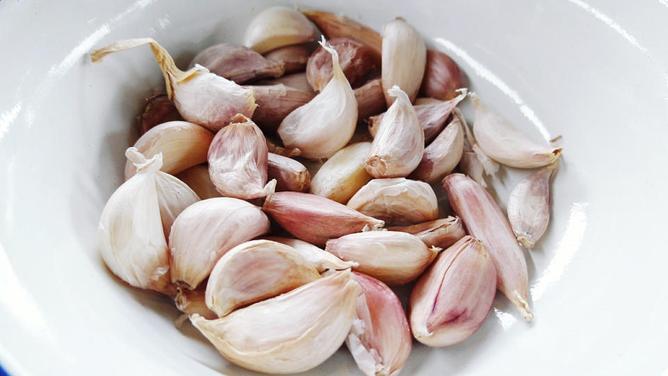 Garlic gloves in a bowl