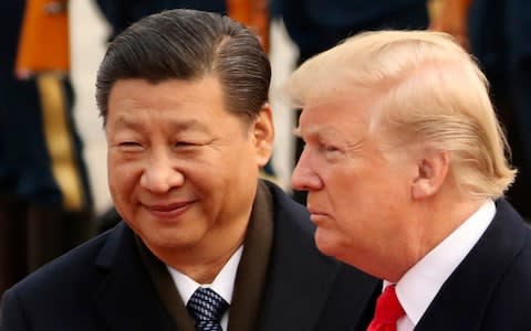 Donald Trump has talked up his friendship with Chinese President Xi Jinping while also challenging his county on trade - Credit: AP Photo/Andrew Harnik