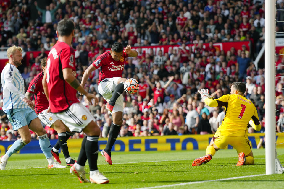 Manchester United's Casemiro, centre, scores his side's second goal during the English Premier League soccer match between Manchester United and Nottingham Forest at the Old Trafford stadium in Manchester, England, Saturday, Aug. 26, 2023. (AP Photo/Jon Super)