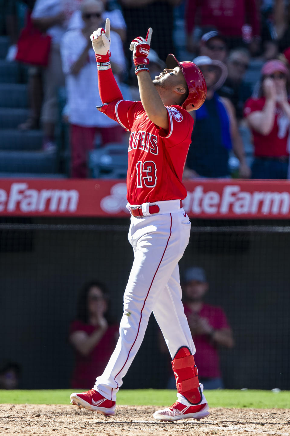Los Angeles Angels' Livan Soto points skyward after hitting a two-run home run against the Seattle Mariners during the seventh inning of a baseball game in Anaheim, Calif., Sunday, Sept. 18, 2022. (AP Photo/Alex Gallardo)