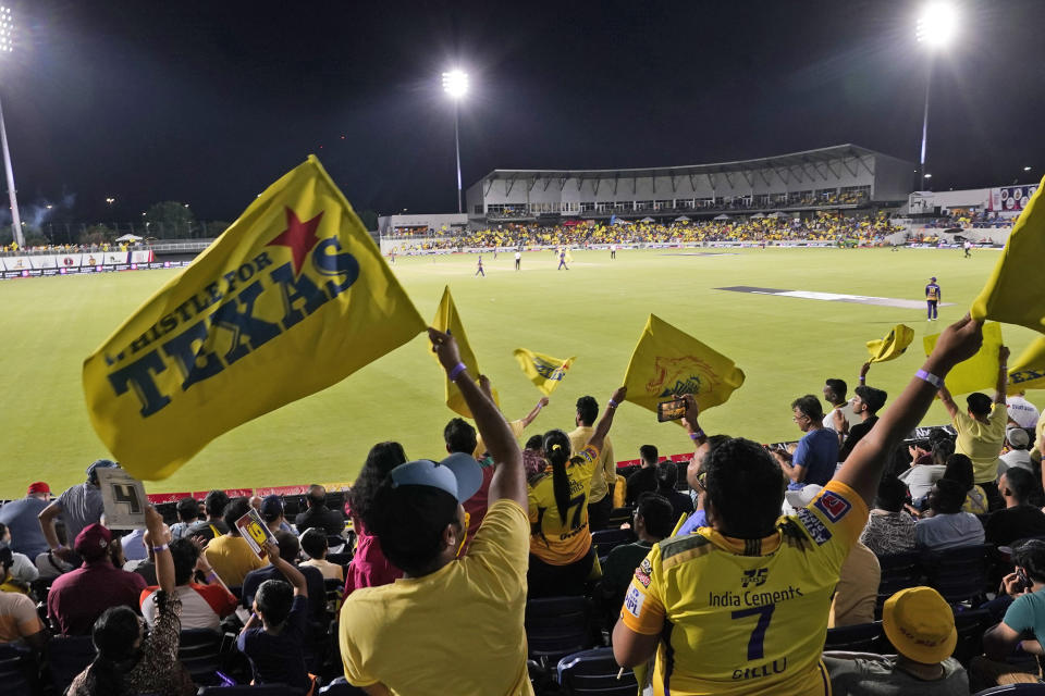 Fans in the stands watch the Texas Super Kings and Los Angeles Knight Riders compete in a Major League Cricket match in Grand Prairie, Texas, Thursday, July 13, 2023. Major League Cricket’s inaugural tournament, six teams strong with rosters peppered with players from South Asia, is in full swing. Organizers hope the tourney and its new, sped-up version of cricket helps establish a U.S. foothold for a sport with a vast international following but little interest so far among American fans. (AP Photo/LM Otero)