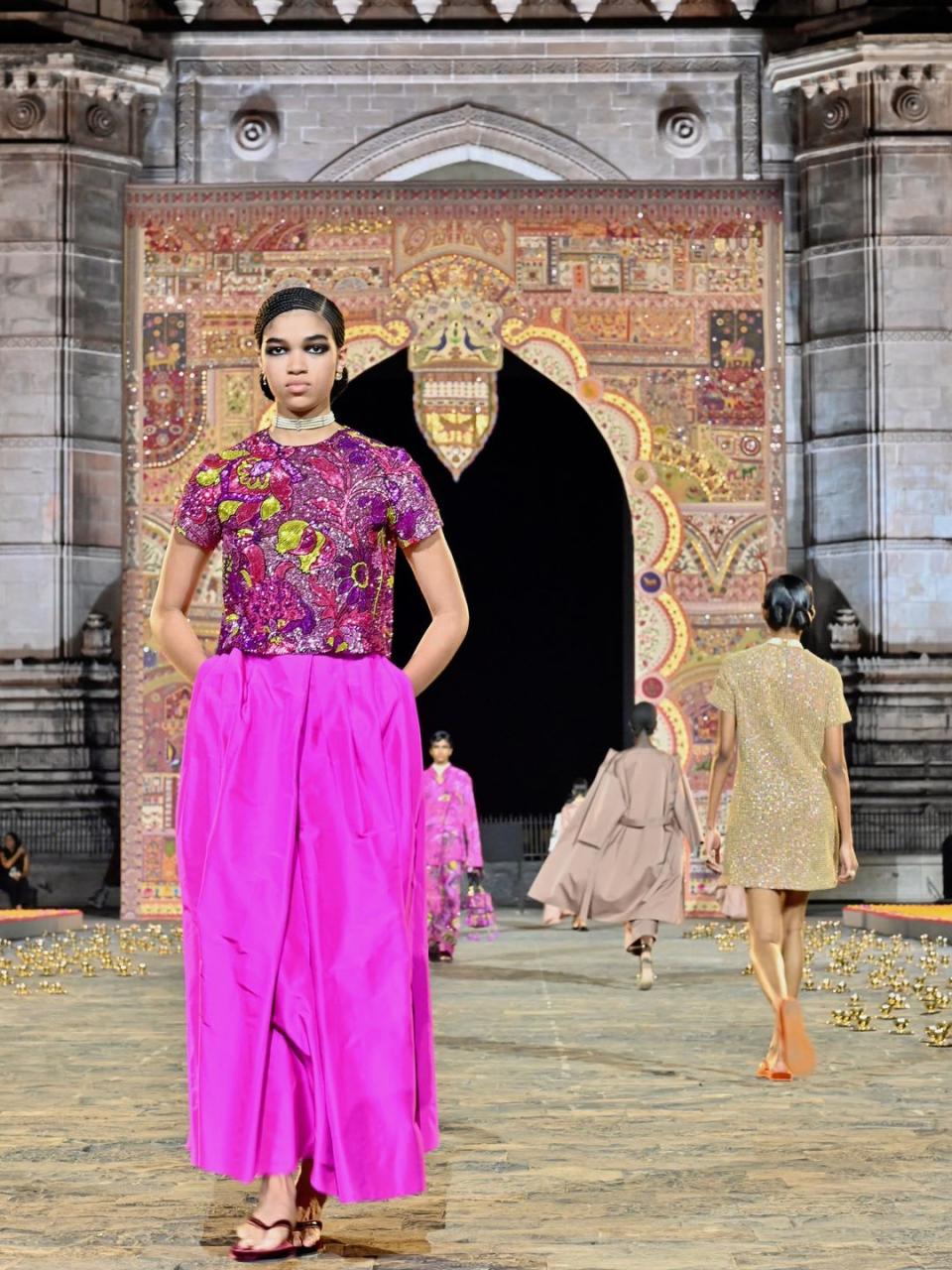 MUMBAI, INDIA - MARCH 30: A model walks the runway during the Dior Fall 2023 show at the Gateway of India monument on March 30, 2023 in Mumbai, India. (Photo by Rubina A. Khan/Getty Images)